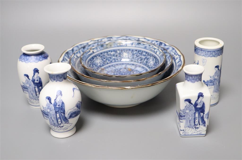 A graduated set of three Chinese porcelain blue and white bowls, largest 19cm and a group of four miniature Chinese blue and white vase